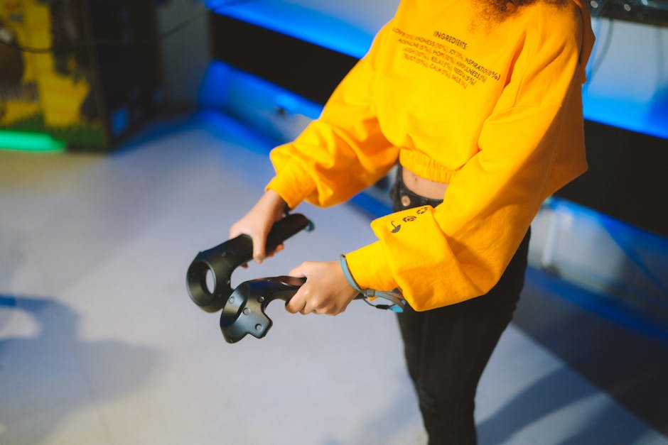 Person engaging in virtual reality gaming indoors with controllers.