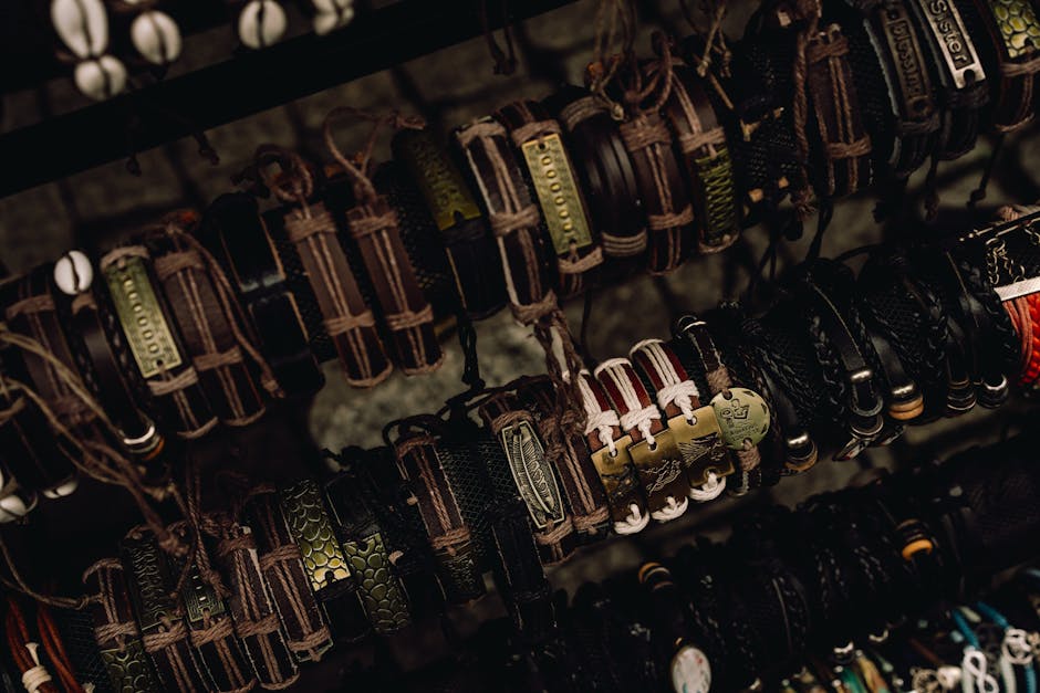 A collection of handcrafted leather bracelets displayed artistically on a rack.